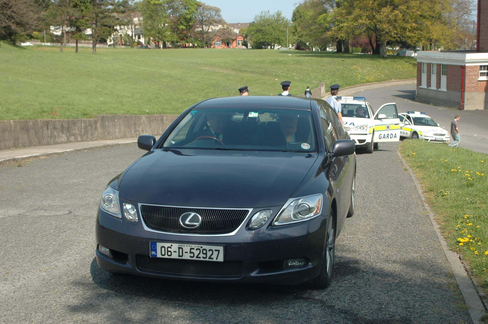 Bertie Ahern, Dick Roche and lots of Gardai arrive at school. This was 2006